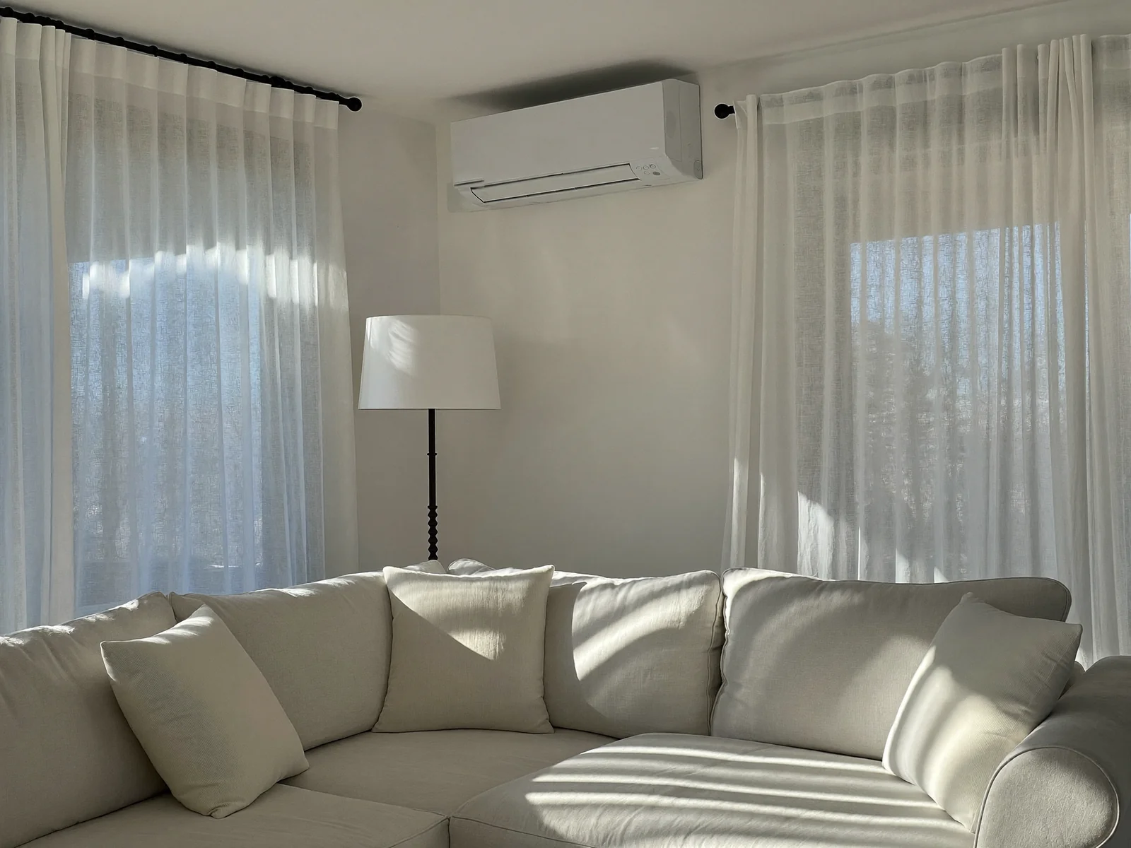 A finished room — cool again, unit on the wall